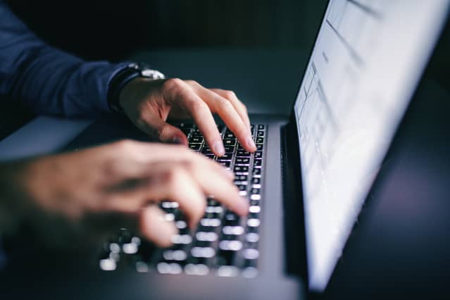 Hands typing on laptop Hands typing on laptop