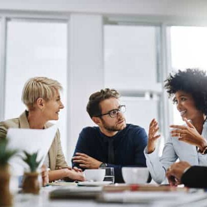Shot of a group of businesspeople sitting together in a meeting Shot of a group of businesspeople sitting together in a meeting
